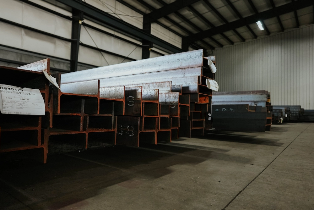 Steel angles, channels, and beams stacked together